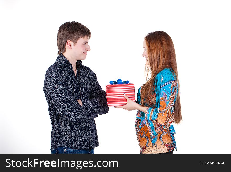 Young couple with a gift isolated
