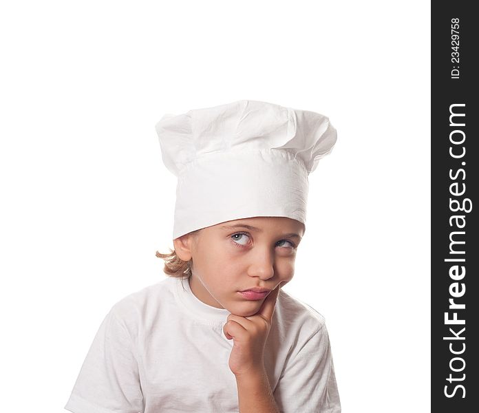 Thoughtful little cook on a white background