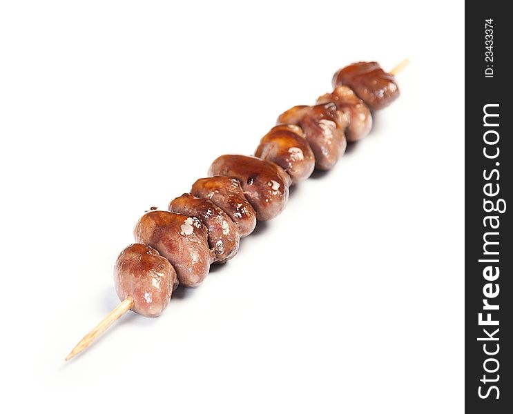 Grilled Chicken Heart on a skewer on white background