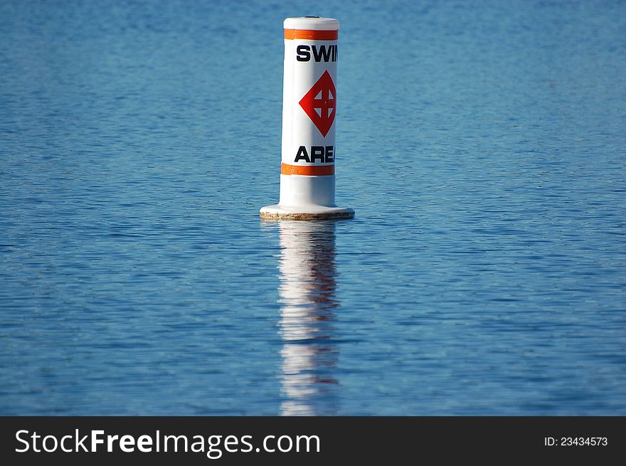 A swim buoy isolated on a blue background.