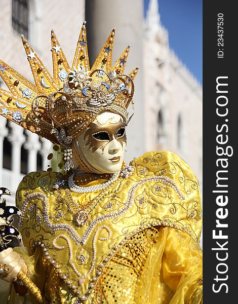 A yellow carnival mask in VEnice, Italy.