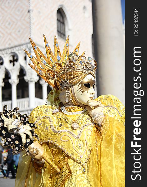 A detail of yellow venetian mask. A detail of yellow venetian mask