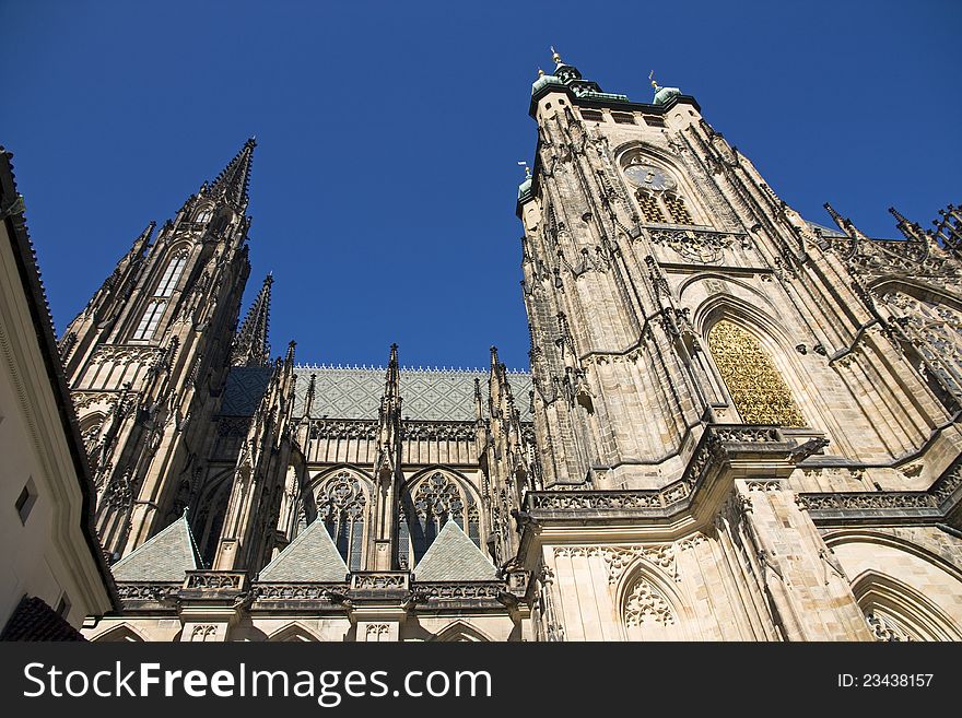 St. Vitus Cathedral at Prague Castle, St. Vitus Cathedral side, St. Vitus Cathedral on a sunny day, St. Vitus Cathedral with blue sky, tourist place in Prague
