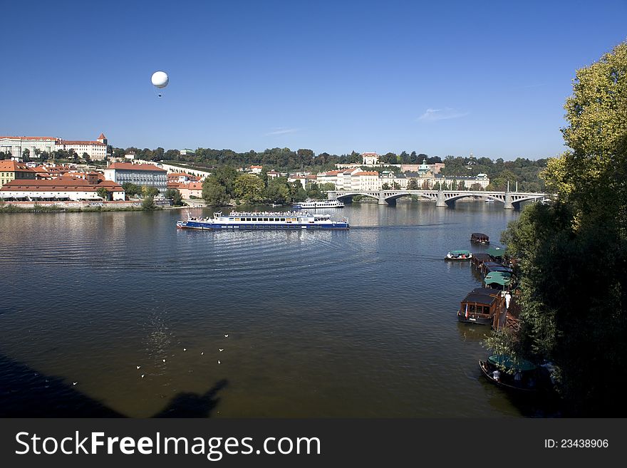 Boat cruise on the Vltava River, Prague look at the bridge, cruise balloon above Prague, sunny day in Prague, summer day in Prague and cruise balloon