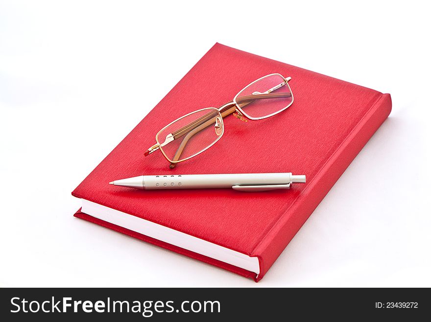 Glasses And The Pen On The Book