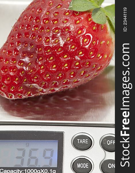 Scales with a strawberry to see your weight. Scales with a strawberry to see your weight