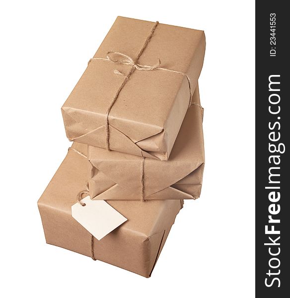 Parcel wrapped with brown paper tied with rope isolated on white background. Parcel wrapped with brown paper tied with rope isolated on white background