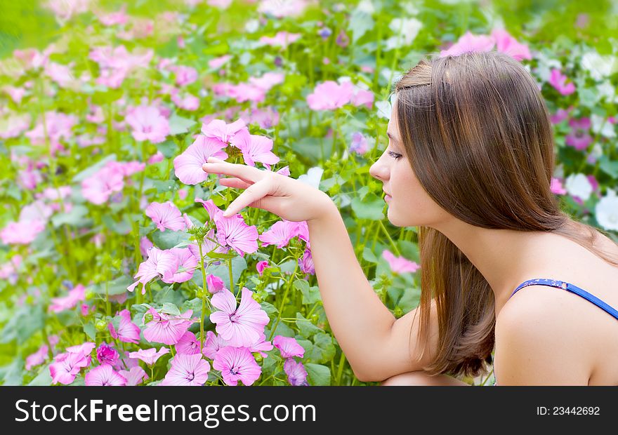 Girl with flowers in the garden