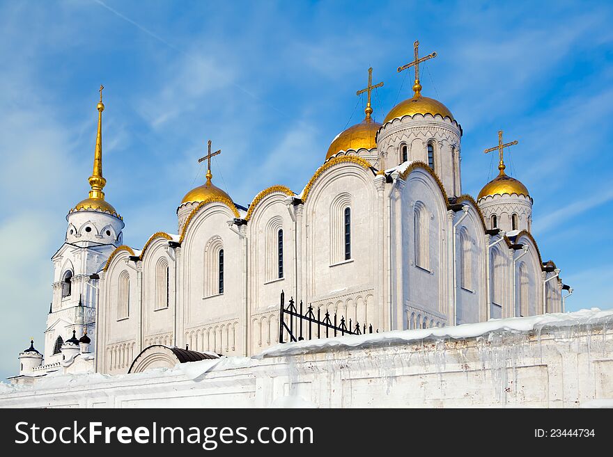 Golden domes of the Russian Orthodox church against the blue sky background