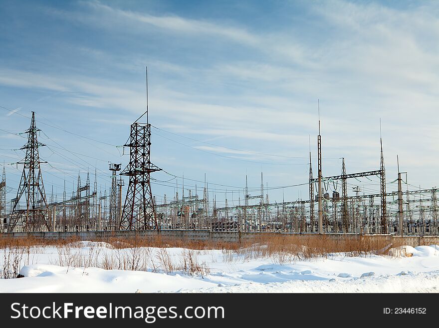 Power plant against an unflawed sky. Winter