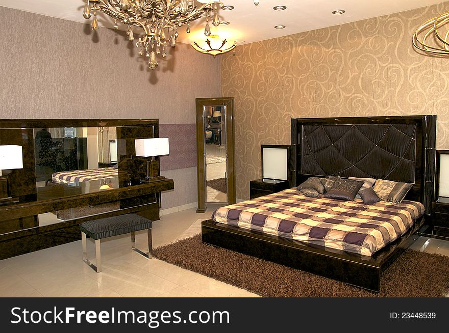 Large bedroom with a bed and night table