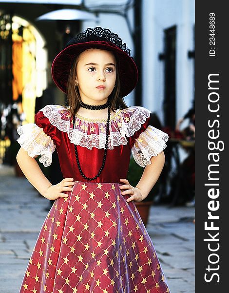 Girl Dressed In Vintage Dress With Hat