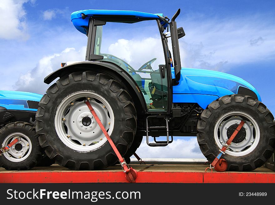 Image of a new tractor with blue skies in the background