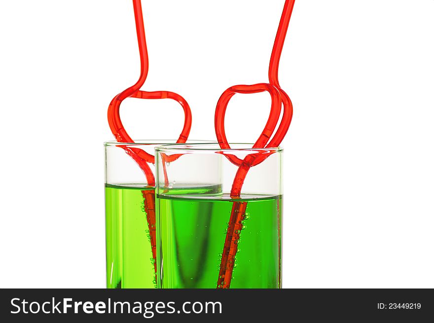 Two glasses with heart straws