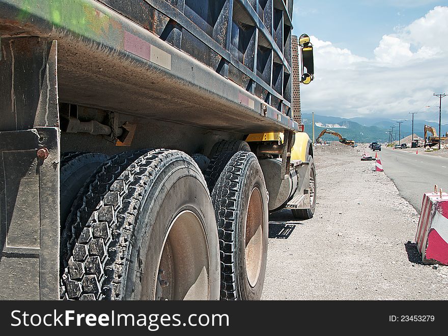 Large ten-wheel truck parked on road construction site. Large ten-wheel truck parked on road construction site