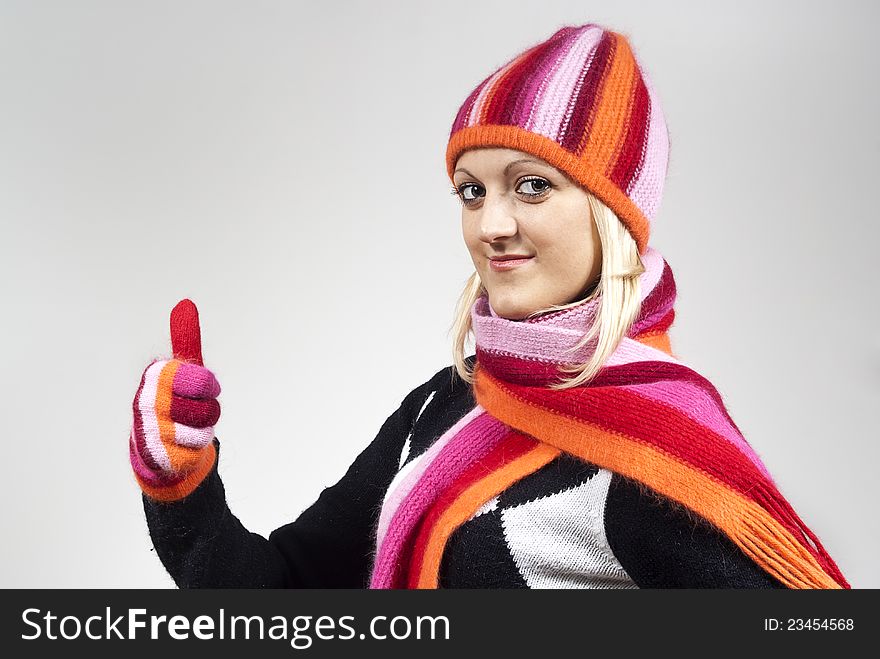 Girl in a hat and gloves, shows approximately. Girl in a hat and gloves, shows approximately