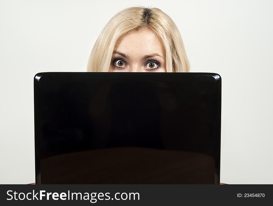 Beautiful girl looking from a laptop