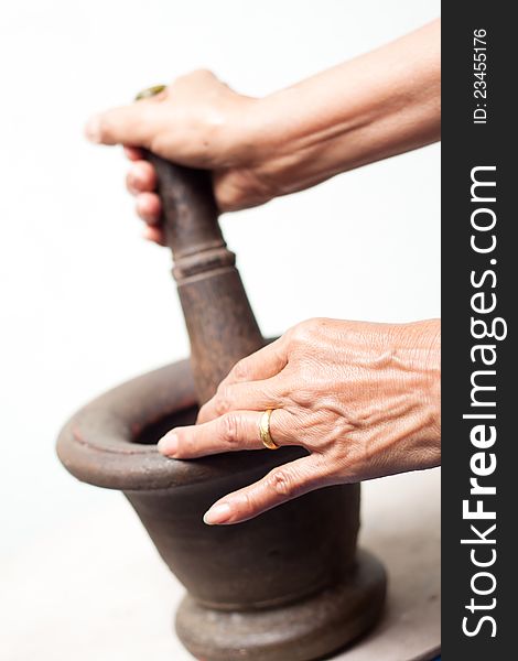 Old woman 's hands with mortar, thai cuisine. Old woman 's hands with mortar, thai cuisine