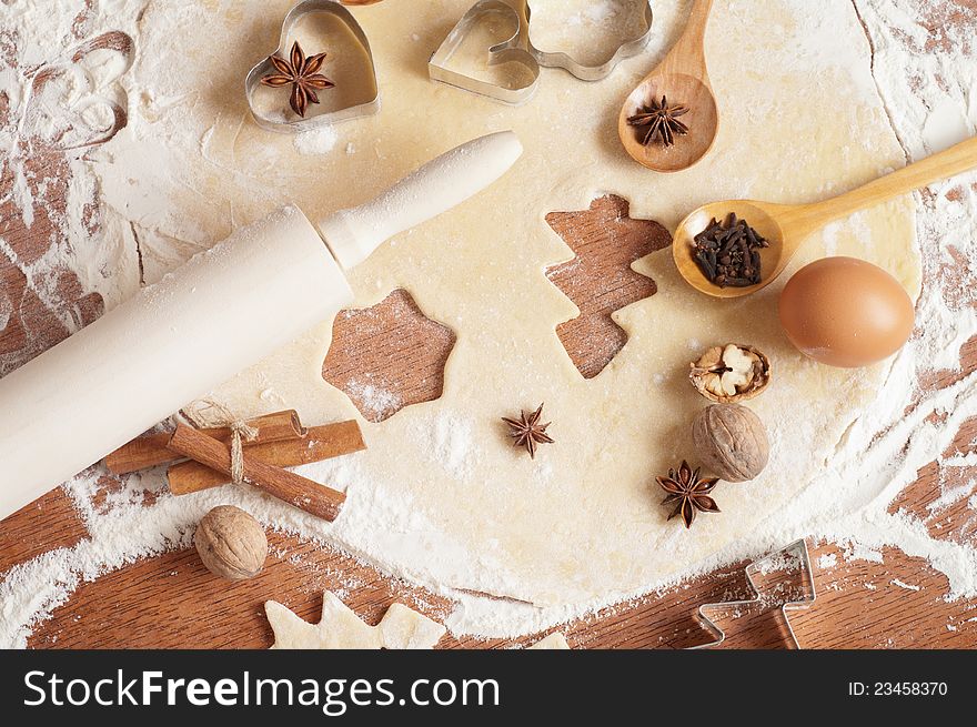 Baking background with dough, spices and cookie cutters