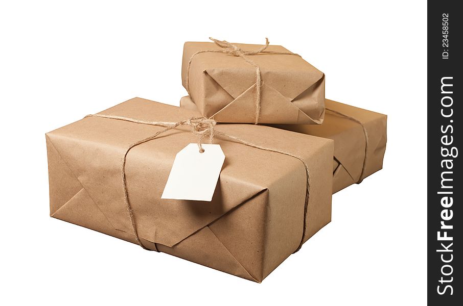 Parcel wrapped with brown paper tied with rope isolated on white background. Parcel wrapped with brown paper tied with rope isolated on white background