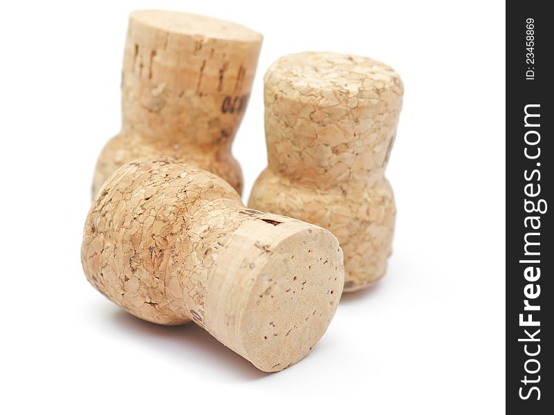 Three Cortical champagne corks on white background