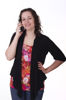 Young Brunette In Black Sweater Smiling On Phone Stock Images