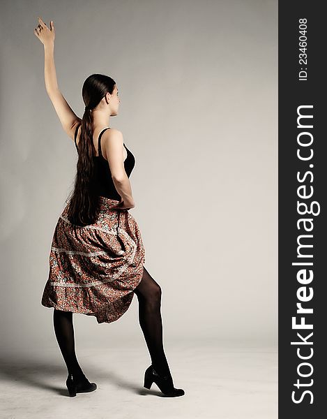 Girl with skirt posing in a studio