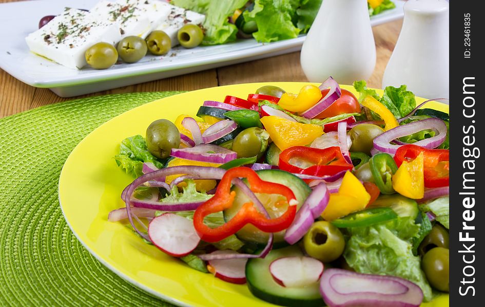 Plate with fresh and healthy salad on the table. Plate with fresh and healthy salad on the table