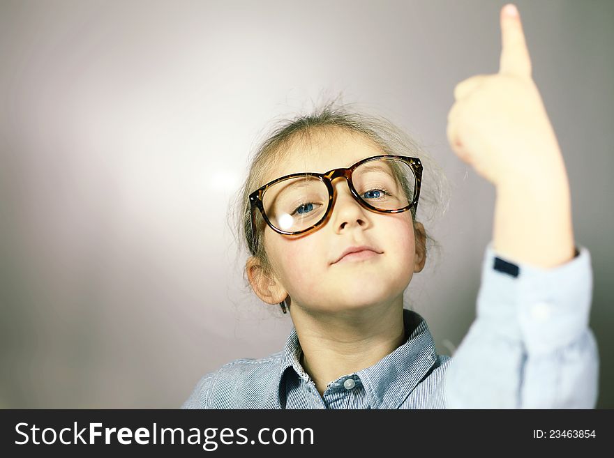 Schoolgirl with big glasses blonde with blue eyes. Schoolgirl with big glasses blonde with blue eyes