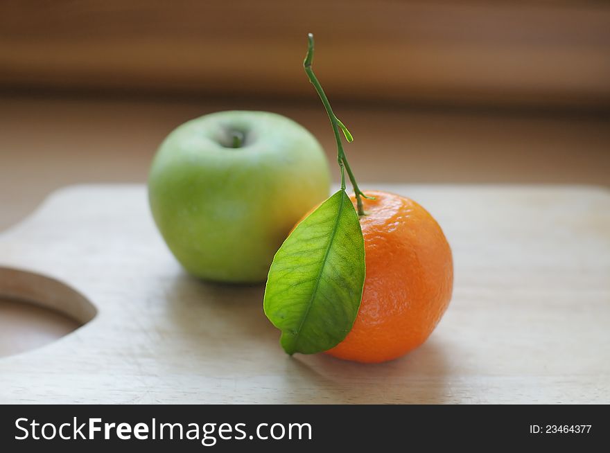 Fresh moroccan tangerine (mandarin) and green apple. Fresh moroccan tangerine (mandarin) and green apple