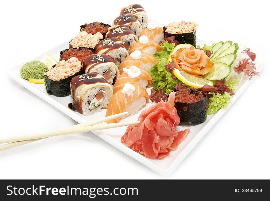 Large plate of sushi and cucumber salad decoration