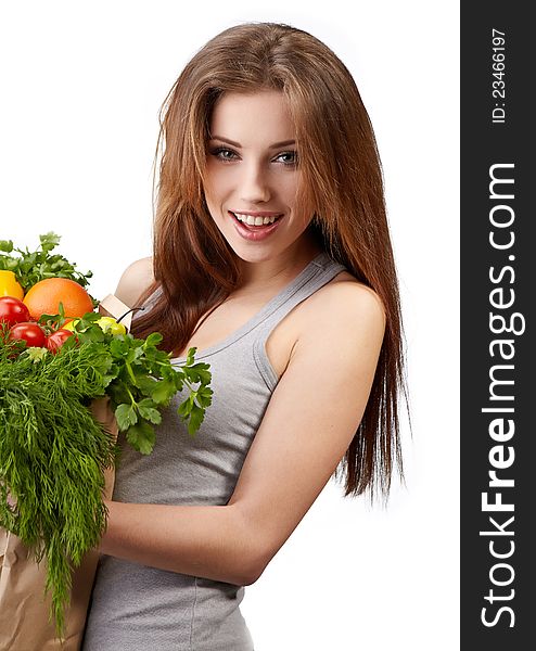 Woman holding a bag full of healthy food. shopping . Woman holding a bag full of healthy food. shopping .