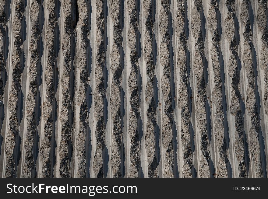 Concrete wall texture, with vertical, wavy pattern. Concrete wall texture, with vertical, wavy pattern