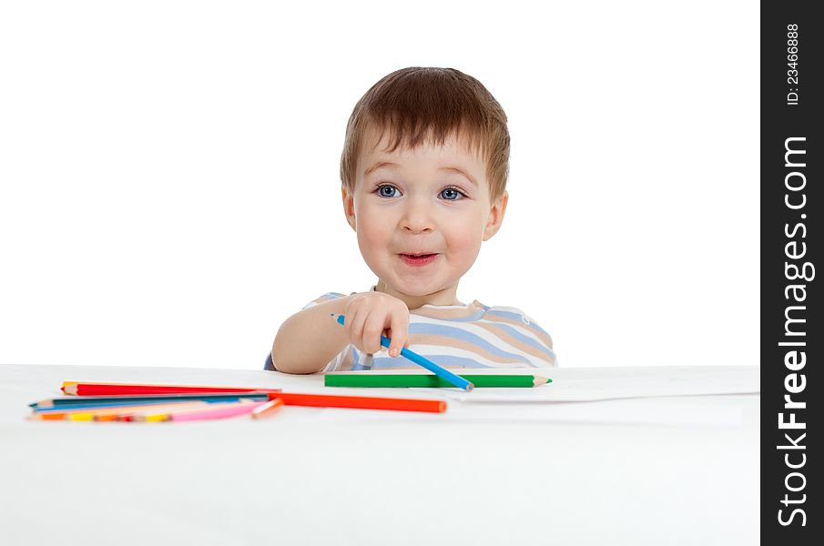 Funny baby boy drawing with color pencils