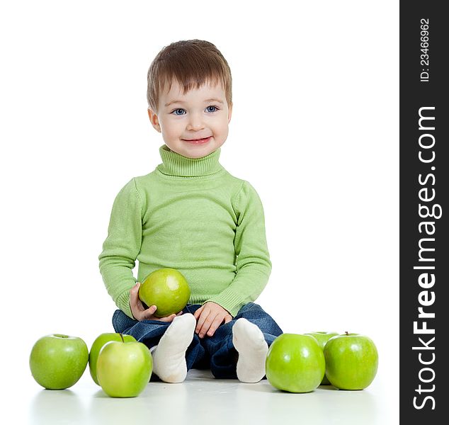 Adorable child with green apples over white background