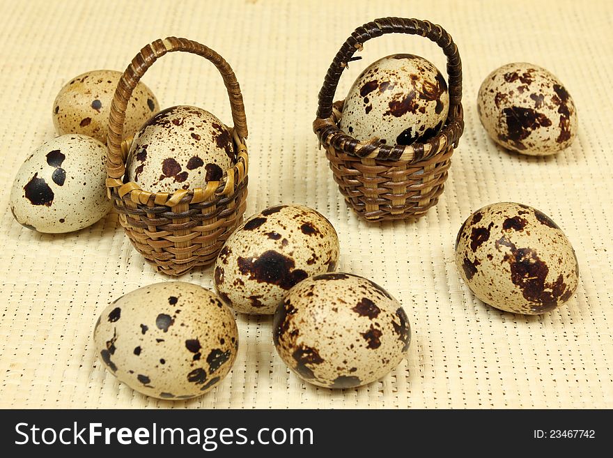 Quail eggs in the baskets. Quail eggs in the baskets