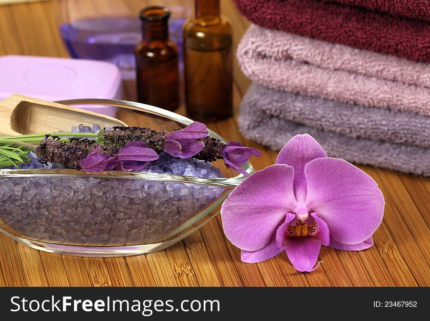 Spa relaxation composition - bath soap, towels, orchid flower, bottles with lotions. Spa relaxation composition - bath soap, towels, orchid flower, bottles with lotions