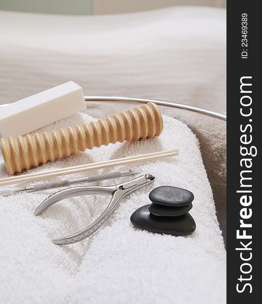 Foot Massager and Pedicure Tools with Towels in Bowl. Foot Massager and Pedicure Tools with Towels in Bowl