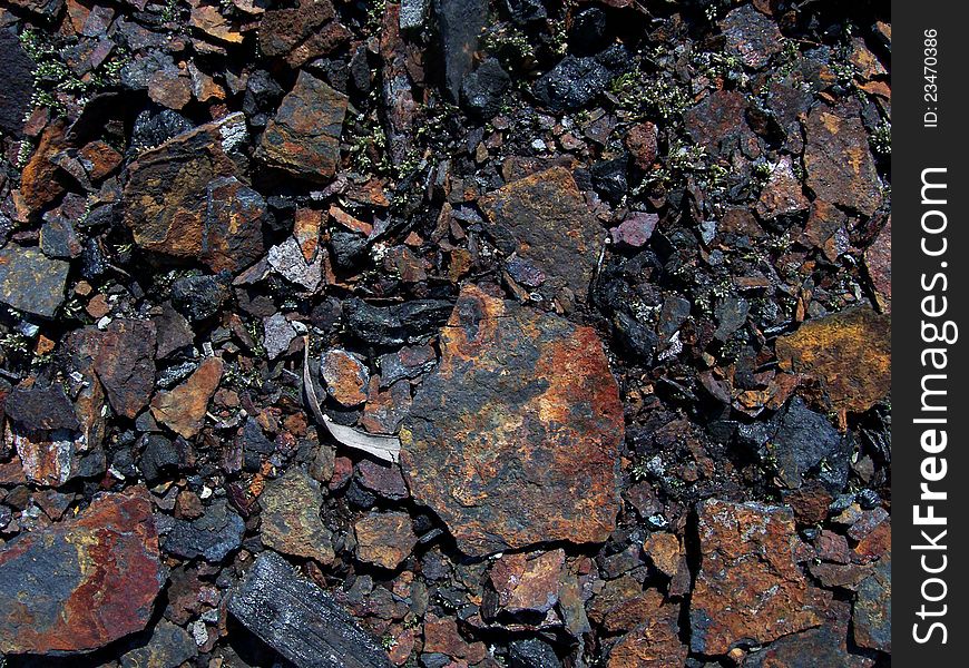 Dilapidated black and rusty ground. Dilapidated black and rusty ground.