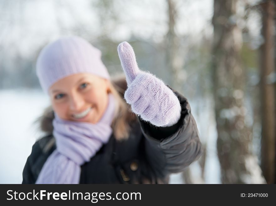 Smiling woman on the background of winter landscape