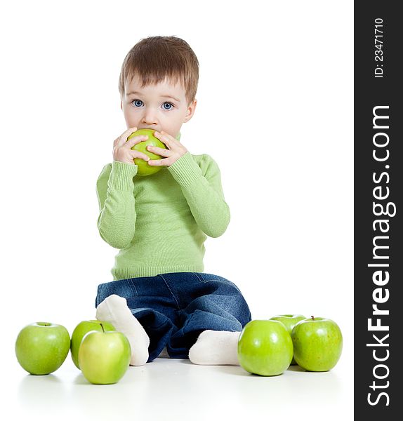 Adorable child with green apples over white background