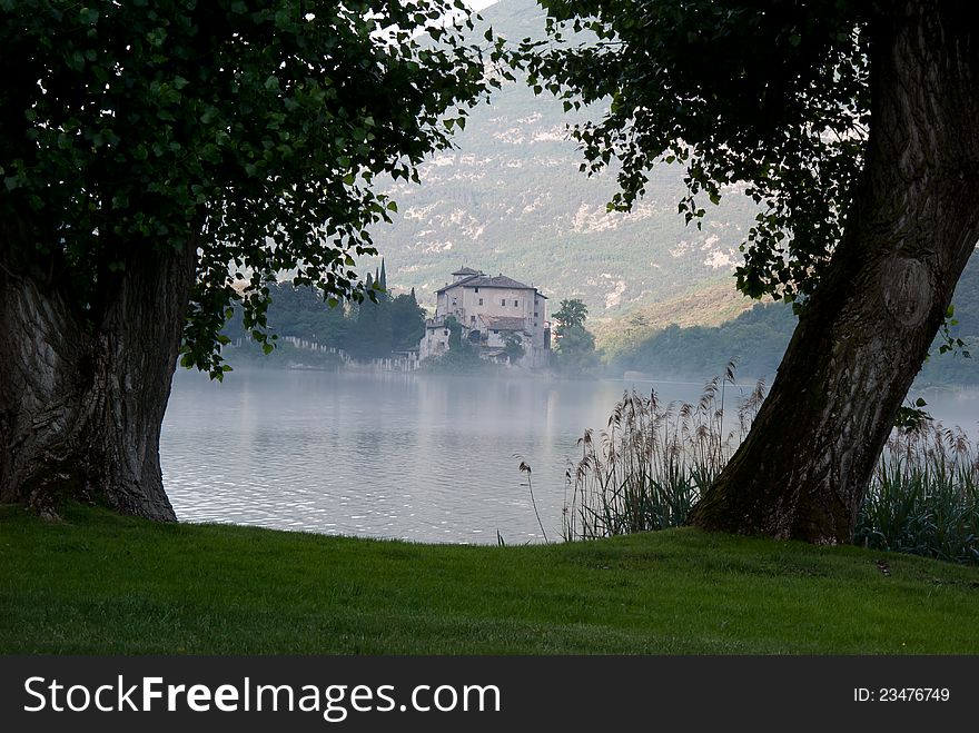 A suggestive view of an ancient manor built on a lake. A suggestive view of an ancient manor built on a lake