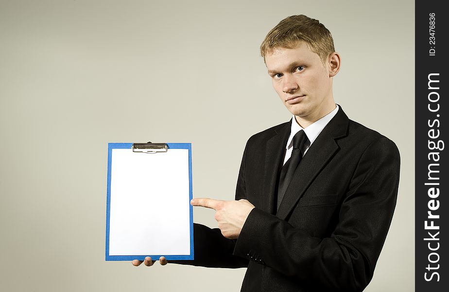 A young man shows on the plan in the studio