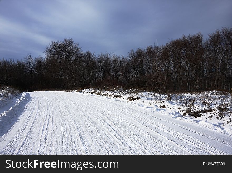 Snowy Road With Tracks