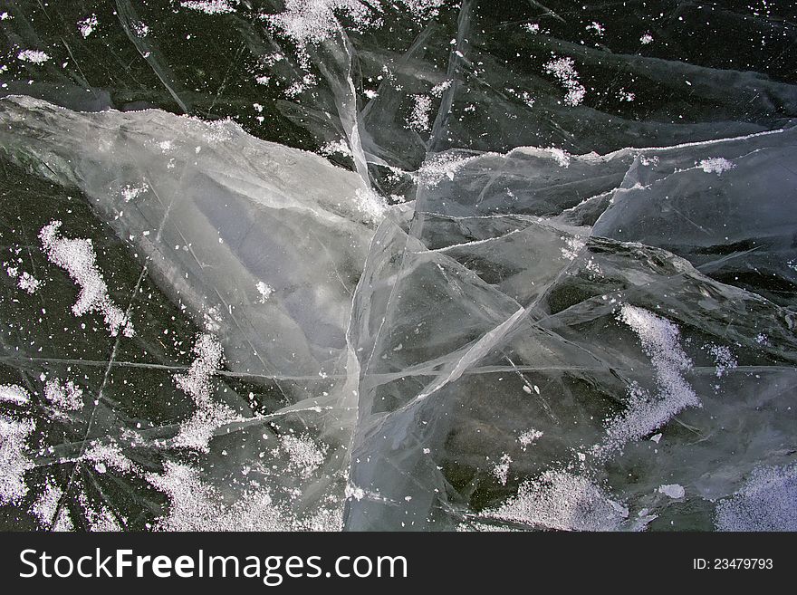 Ice on a frozen lake with dangerous cracks. Ice on a frozen lake with dangerous cracks