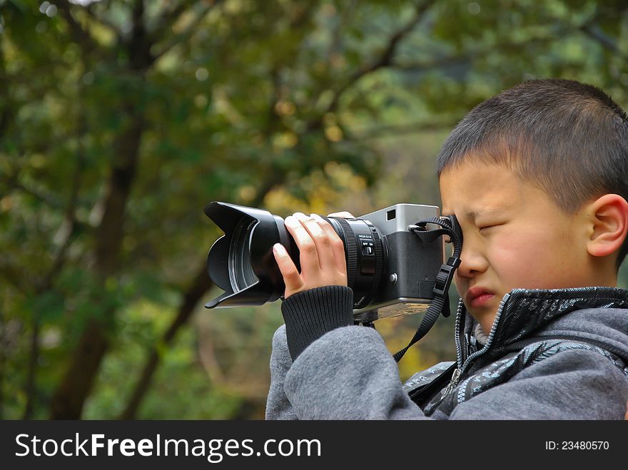 Photography-loving childrenï¼ŒPhotographerï¼ŒChinese. Photography-loving childrenï¼ŒPhotographerï¼ŒChinese