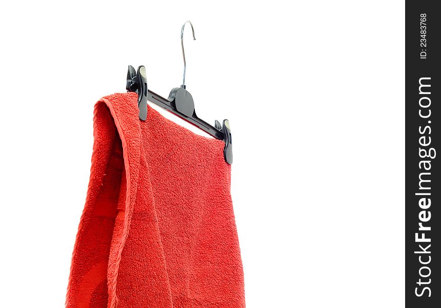 Red towel for a shower on a hanger