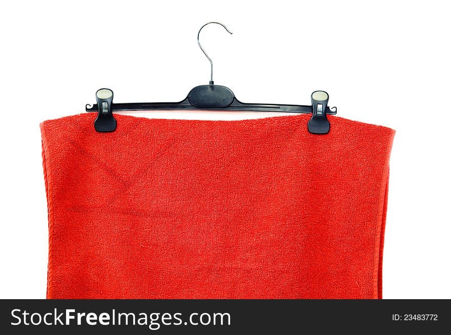Red towel for a shower on a hanger