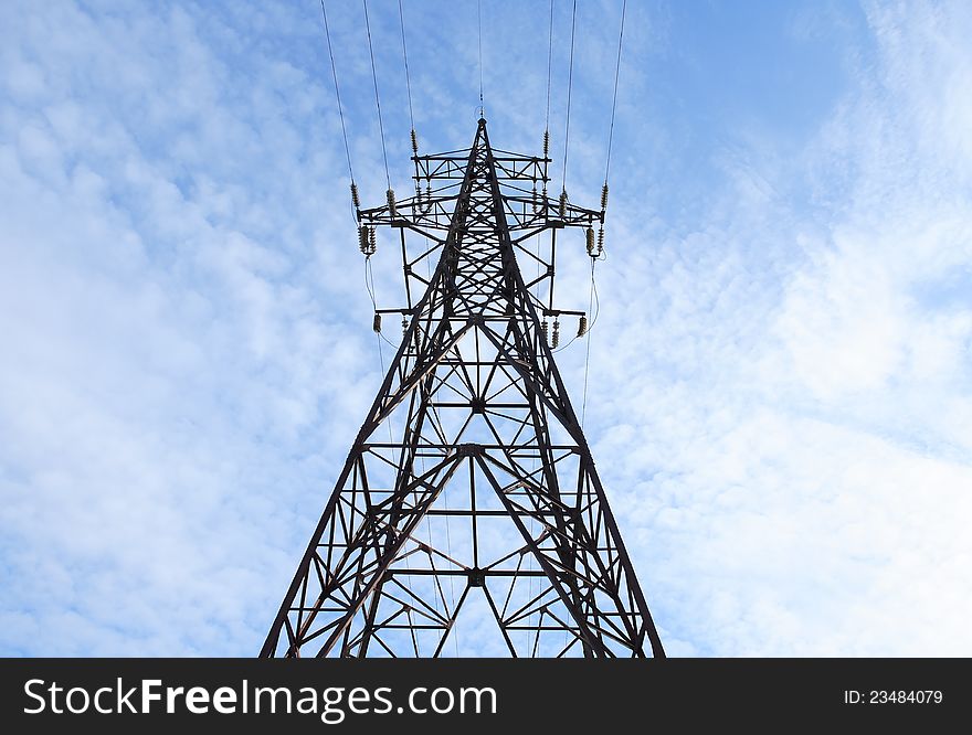 High voltage tower against blue sky. High voltage tower against blue sky