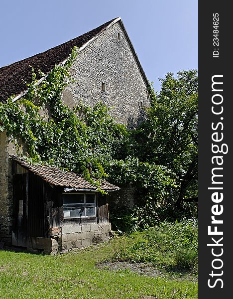 An old farm photographed in a village in France. An old farm photographed in a village in France.